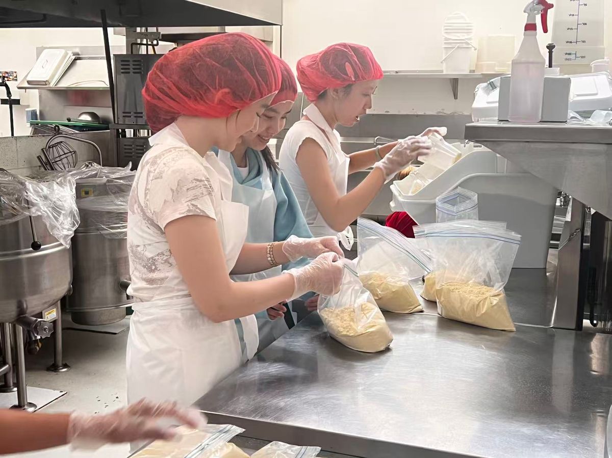 Team members volunteering in the food-bank kitchen