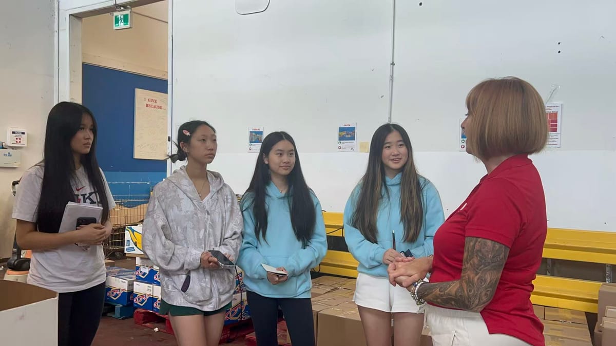 The project team speaking with food-bank staff