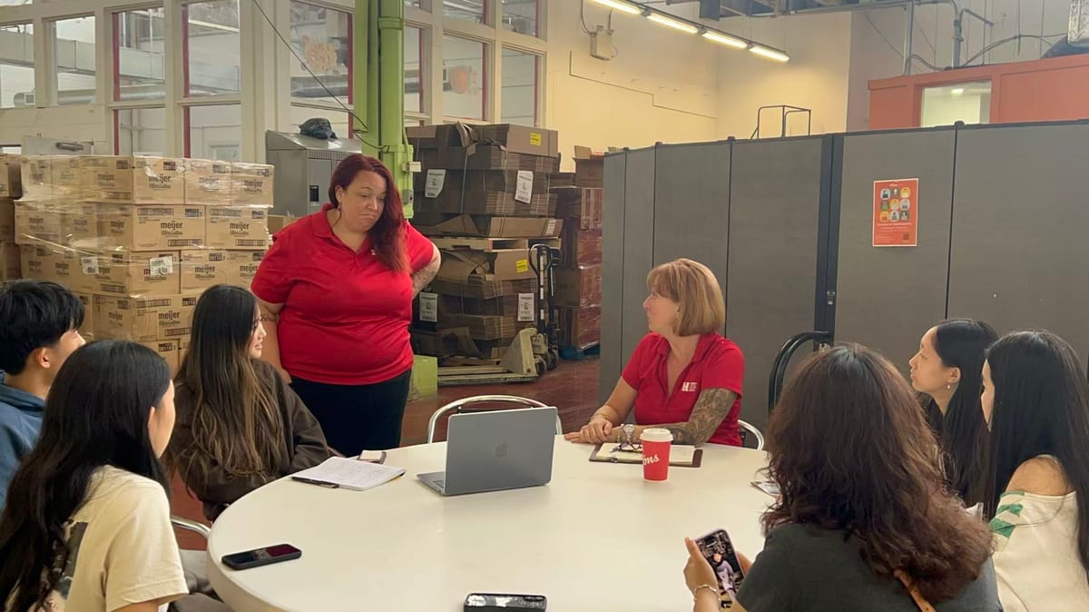 Food Bank Expiry Tracking System project team meeting with food-bank staff